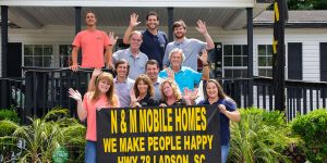 Featuring mobile home sales team group portrait
