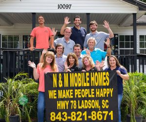 Showing staff group photo at mobile home center