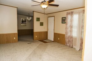 Showing land home kitchen with upgraded cabinet storage