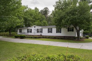 Displaying land home exterior on one eighth acre property