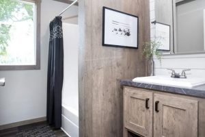Showing farmhouse guest bath with upgraded home fixtures