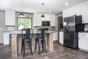 Featuring farmhouse kitchen details with modern finishes