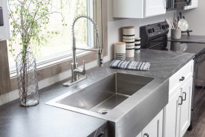 Displaying farmhouse kitchen with spacious cabinet storage