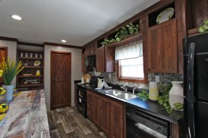 Showing double wide kitchen cabinets and pantry storage