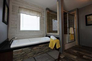 Featuring master bath storage in rustic double wide home
