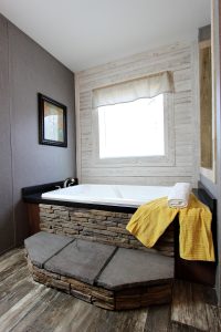Showing rustic double wide bathroom vanity with fixtures
