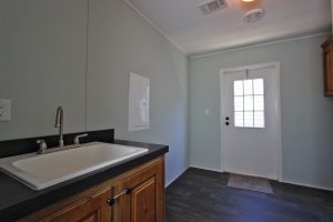 Displaying Kahuna laundry room with practical utility storage