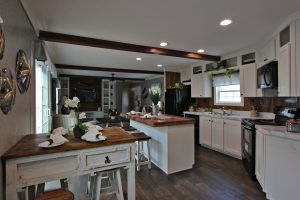 Showing Naples kitchen island with farmhouse details