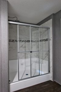 Showing Naples master shower with farmhouse bathroom style