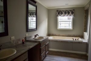Showing home kitchen with modern cabinet layout