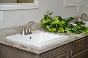 Showing Riviera bathroom vanity with upgraded home fixtures