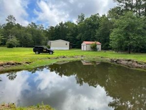 Showing Dorchester land property with five acres and pond area
