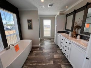 Displaying new ScotBilt floor plan with flexible bedroom options