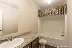 Displaying luxury bathroom features in Stagecoach home