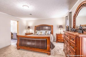 Showing stylish bedroom setup in Kabco Stagecoach home