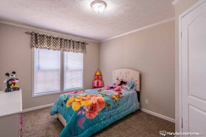Featuring spacious bedroom design with natural lighting