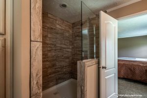 Featuring custom bathroom finishes in manufactured home layout