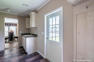 Displaying utility room features inside Kabco mobile home